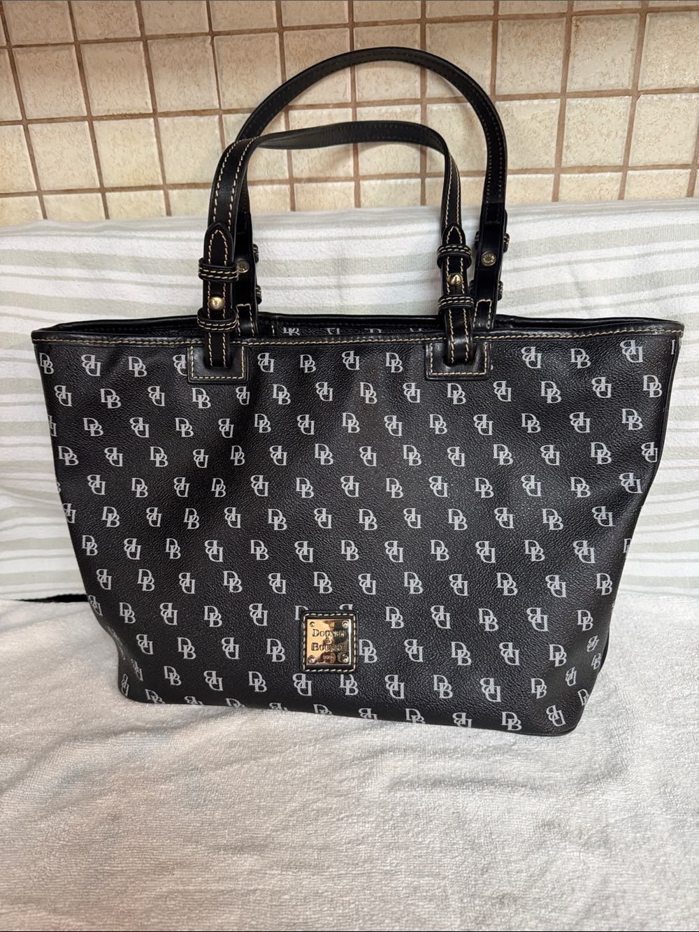 Dooney & Bourke Black Logo-Print Tote Bag w/stain inside bottom corner